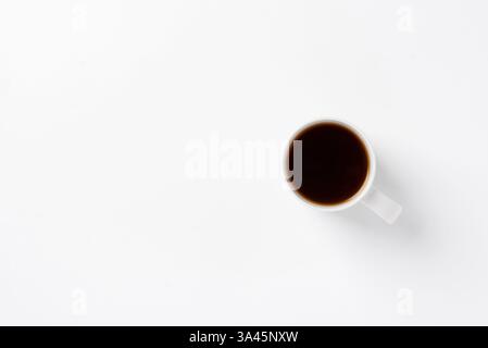 White cup with black coffee on empty white background. Cleanliness concept. Coffee cup background with space for text or design Stock Photo