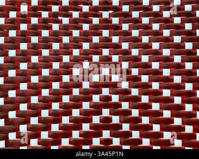 Close up of red and white synthetic rattan or wicker weaving art in vertical stripes pattern. Rattan hand woven background seamless texture. Stock Photo