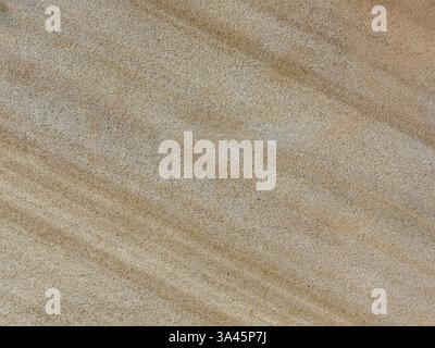 Close up texture of natural beige and cream stone granite slab pattern in marble looking veining and grains, Seamless texture Stock Photo
