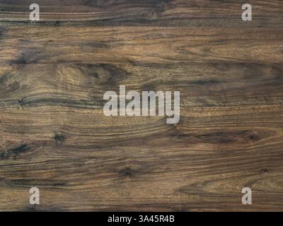 Close up of weathered rustic dark teak wood texture.  Seamless old and rusty wooden timber log background texture. Vintage feel. Stock Photo