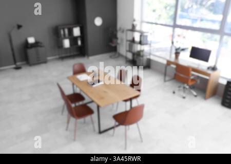 Blurred view of conference hall with tables in office Stock Photo