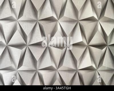 Modern grey 3d geometric wallpaper.  Geometrical wallpaper in triangular and diamond shading. Seamless background texture. Stock Photo