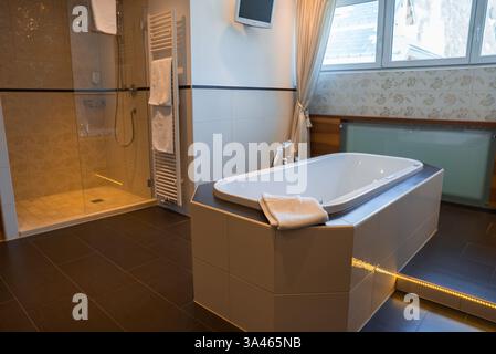 Modern Bathroom with Bathtub and Shower in Ischgl Hotel, Austria Stock Photo