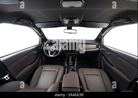 Driver central car panel with dark color interior and isolated white windows Stock Photo