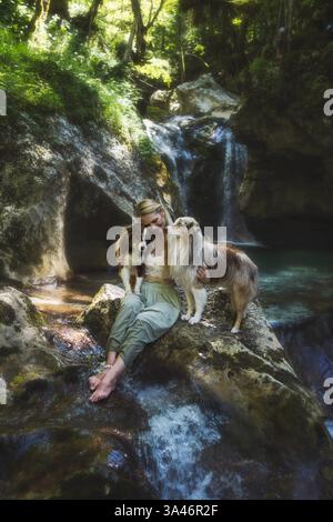 young woman with 2 Miniature Australian Shepherds Stock Photo