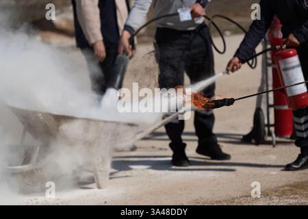 Fire extinguisher used during fire drill in Turkey Stock Photo - Alamy