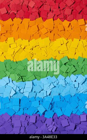 colorful background made from small pieces of rainbow colored applique paper squares Stock Photo