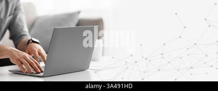Working at laptop pc. Man hands on pc keyboard, typing text or programming code in computer Stock Photo