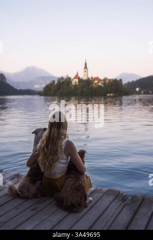 young woman with 2 Miniature Australian Shepherds Stock Photo