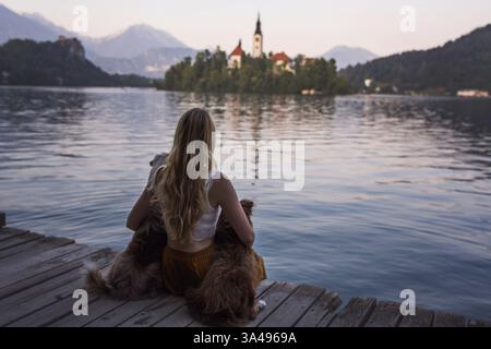 young woman with 2 Miniature Australian Shepherds Stock Photo
