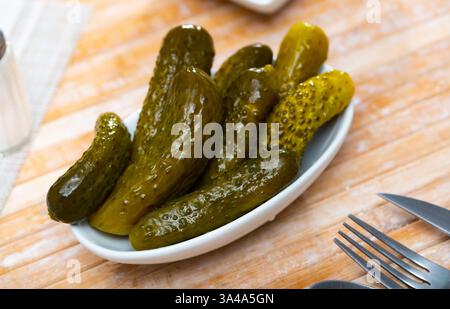 Pile of pickled cucumbers served on table Stock Photo - Alamy