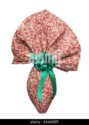 Easter chocolate egg wrapped in red paper with white daisies designs on with green satin bow isolated on white with clipping path included Stock Photo