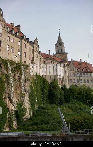 Majestic Sigmaringen Castle Perched on Rugged Cliff Above Tranquil Danube: Historic Hohenzollern Residence Showcases Medieval Architecture and Royal Stock Photo