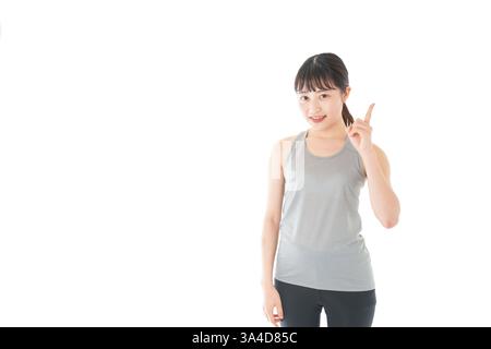 Young woman in sportswear giving advice Stock Photo