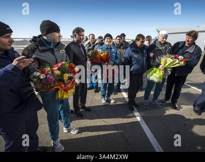 March 16, 2013 - Expedition 34 Russian Flight Engineer Evgeny Tarelkin, left with flowers, Flight Commander Kevin Ford of NASA, center with flowers, and Russian Soyuz Commander Oleg Novitskiy are greeted at the Kustanay Airport a few hours after they landed near the town of Arkalyk, Kazakhstan on Saturday, March 16, 2013...Expedition 34 Crew Return, Kustanay, Kazakhstan - 16 Mar 2013..Ford, Novitskiy, and Tarelkin are returning from 142 days onboard the International Space Station where they served as members of the Expedition 33 and 34 crews.  (Credit Image: © NASA/ZUMA Wire) Stock Photo
