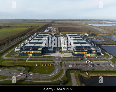 Aerial drone views of a supercomputer data center, artificial intelligence, and internet infrastructure in the Netherlands. Big data, quantum Stock Photo