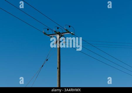 Local junction of power lines from the electricity grid on a utility pole. Stock Photo