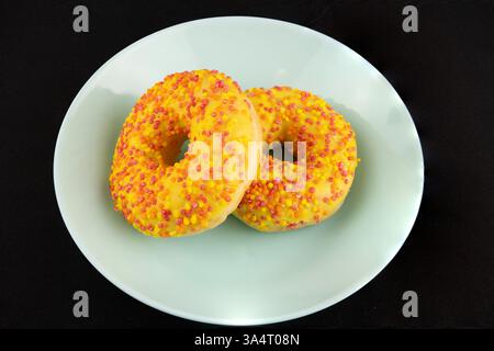 Golden Donuts on a Black Background Stock Photo
