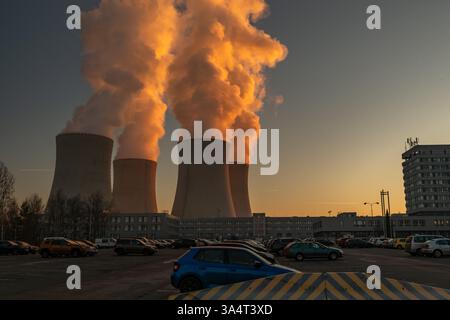 Big chimneys with white smoke in winter sunny day near nuclear power plant in Temelin CZ 02 04 2025 Stock Photo