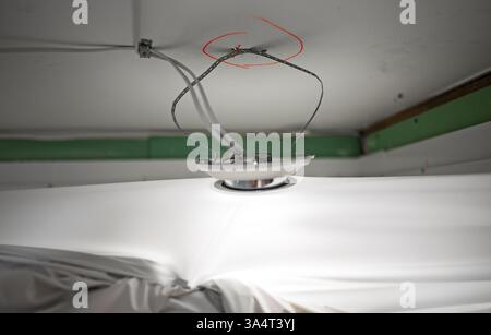 Replacing the stretch ceiling in the bathroom. Stock Photo