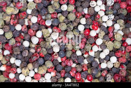 different peppercorns black, red, white close-up Stock Photo