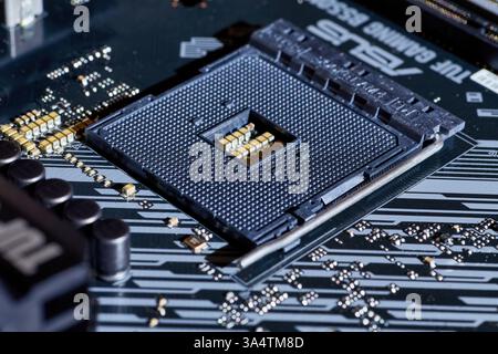 A close-up view of an AM4 CPU socket on a motherboard. This detailed ...