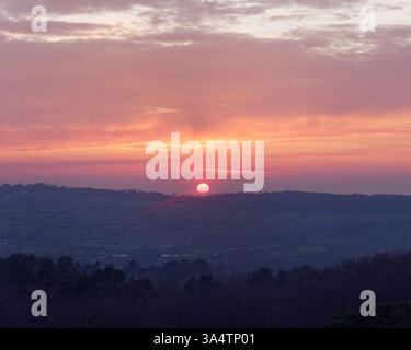 The sun sets over the hills and countryside full of terraced fields in Biddulph, Staffordshire, Mar 25 Stock Photo