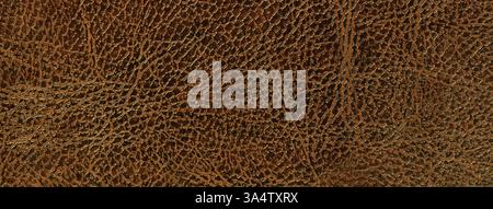 lacquered brown leather texture background, closeup. Dark orange backdrop from wrinkle skin, structure of textile. Stock Photo