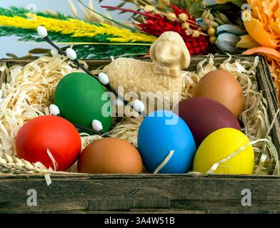 painted eggs in different colors, butter lamb, Easter palm and other elements, background, wallpaper Easter theme Stock Photo
