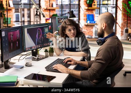 Professional photo editor interacts with AI chatbot and retouching software on dual monitors, using machine learning tools to generate high quality images. Photography industry with automation. Stock Photo