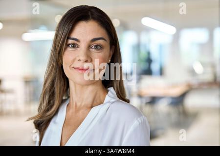 Headshot portrait of happy middle aged business woman professional executive. Stock Photo
