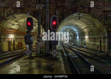 From Rossio train station into an illuminated train tunnel, a tunnel under the center of Lisbon. Stock Photo