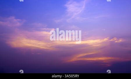 Sun shines brightly on the dark beautiful sky, Beautiful cloud at dusk over the city, Nature background, Evening sky, Sunset, Colorful cloud in summer Stock Photo