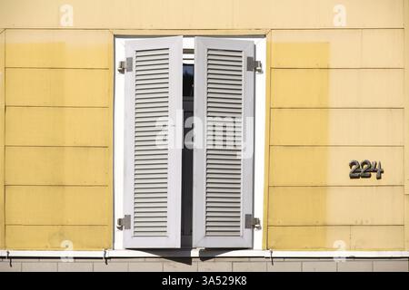 A closed new wooden shutter on a residential building Stock Photo