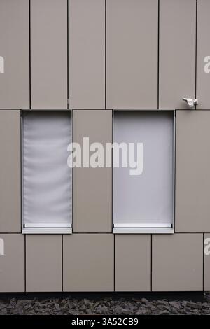 A modern house facade with sheet metal covering and an installed ...