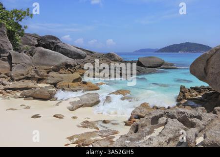 The sand beach adjacent to the cliffs and azure water Stock Photo - Alamy