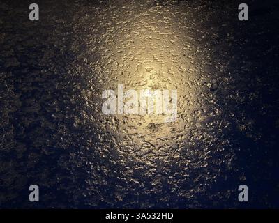 textured ice, golden reflection, abstract background Stock Photo