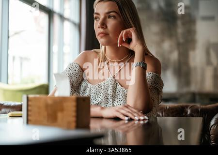 Young beautiful woman is in the restaurant. Stock Photo
