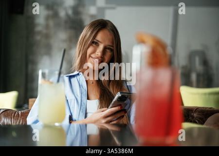 Young beautiful woman is in the restaurant. Stock Photo
