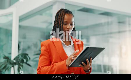 Research, browsing and woman with tablet, office and checking for performance of ad, online or digital. Scroll, marketing manager and black person Stock Photo