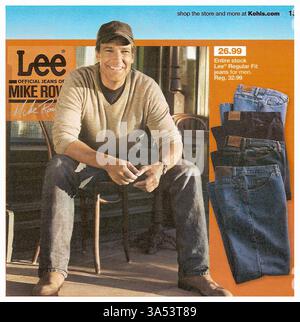 2010 print advertisement for Lee Jeans featuring Mike Rowe. The ad showcases Rowe wearing Lee jeans, with a stack of folded Lee jeans Stock Photo