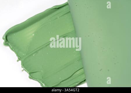 Green cosmetic smear texture. skin care product sample. Green tea, kaolin or spirulina face mask swatch on white background. Anti acne treatment Stock Photo