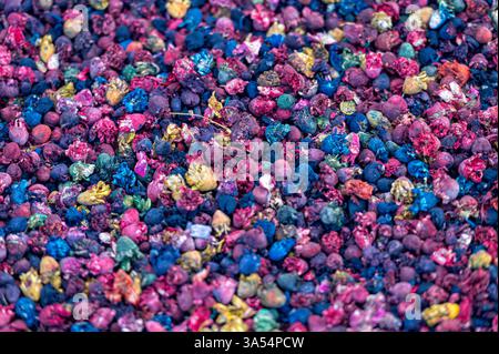 Brightly colored spices and tea blend together at a bustling Marrakech market. Stock Photo