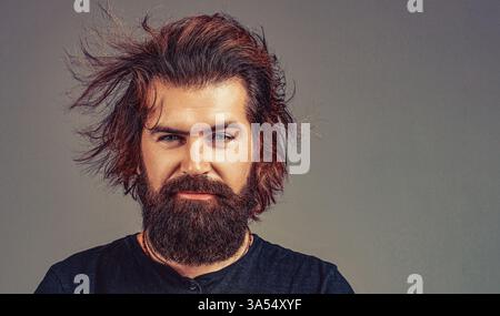 Man haircut in barber shop. Smiling man. Bearded man, stylish hairstyle, beard Stock Photo