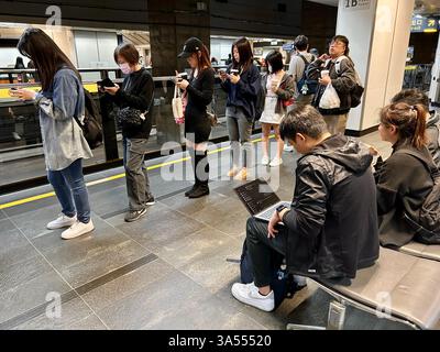 Taipei, Taiwan, Crowd People, Tourists, Traveling, Taipei Main Train Station, Sitting inside, Waiting for High Speed Train, Women Standing on Line Stock Photo