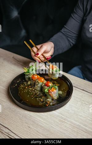 spring rolls in rice paper with soy sauce Stock Photo