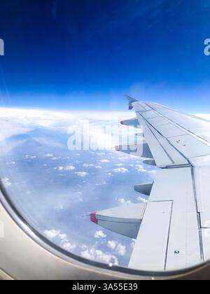 A view from an airplane window in flight Stock Photo
