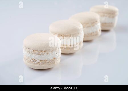 Close up view. Bunch of macarons on the white surface. Stock Photo