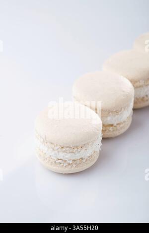 Bunch of macarons on the white surface. Stock Photo