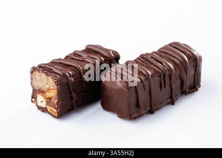 Chocolate bars lie on a white surface, isolated. Stock Photo